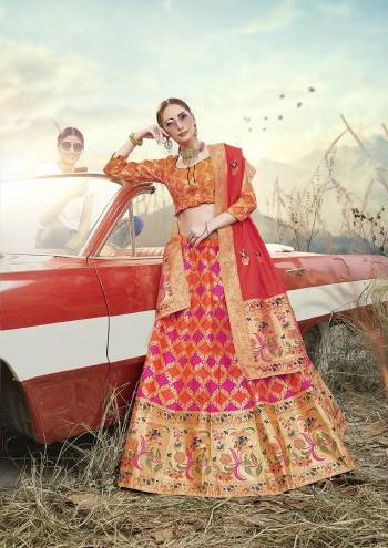 Look Pretty In This Designer Silk Based Lehenga Choli In Orange Color Paired With Contrasting Red Colored Dupatta. It Is Fabricated On Banarasi Jacquard Silk Beautified With Weave All Over. Buy This Pretty Piece Now.?