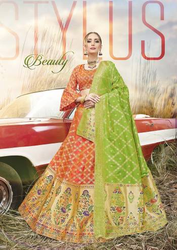 Shine Bright In This Very Beautiful Designer Lehenga Choli In Orange Color Paired With Contrasting Parrot Green Colored Dupatta. This Lehenga Choli Is Fabricated On Banarasi Jacquard Silk Beautified With Weave All Over.