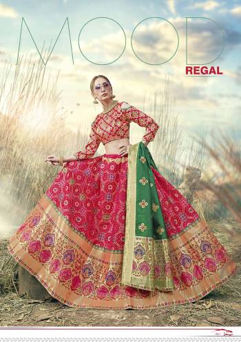 Shine Bright In This Very Beautiful Designer Lehenga Choli In Rani Pink Color Paired With Contrasting Green Colored Dupatta. This Lehenga Choli Is Fabricated On Banarasi Jacquard Silk Beautified With Weave All Over.