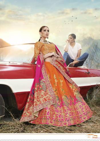 This Festive Season Have A Proper Traditional Look Wearing This Silk Based Lehenga Choli In Orange Color Paired With Contrasting Rani Pink Colored Dupatta. This Lehenga Choli Is Fabricated On Banarasi Jacquard Silk Beautified With Weave All Over.