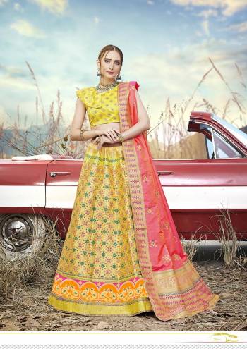 This Festive Season Have A Proper Traditional Look Wearing This Silk Based Lehenga Choli In Yellow Color Paired With Contrasting Pink Colored Dupatta. This Lehenga Choli Is Fabricated On Banarasi Jacquard Silk Beautified With Weave All Over.