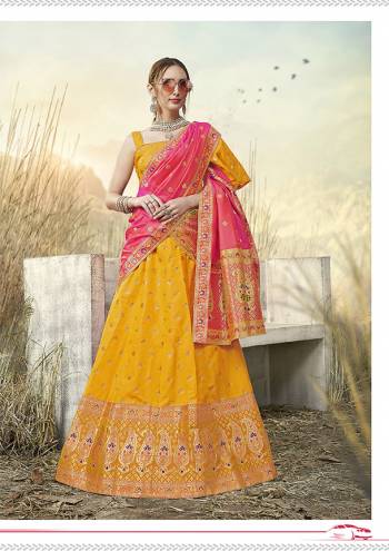 Go With Pretty Shades Wearing This Heavy Weaved Designer?Lehenga Choli In Musturd Yellow Color Paired With Contrasting Pink Colored Dupatta. Its Blouse Is Fabricated On Banarasi Art Silk Paired With Banarasi Jacquard Silk Lehenga And Dupatta