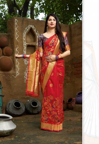 Grab This Designer Silk Based Bright Colored Saree In Red Color Paired With Purple Colored Blouse. This Saree And Blouse Are Fabricated On Banarasi Art Silk Beautified With Weave All Over. 