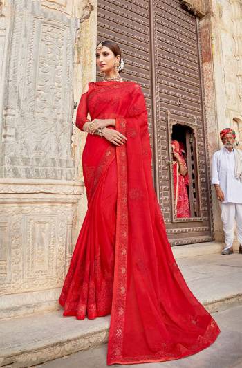 Shine Bright Wearing This Heavy Designer Saree In Red Color. This Pretty Heavy Embroidered Saree Is Georgette Based Paired With Art Silk Fabricated Blouse. 