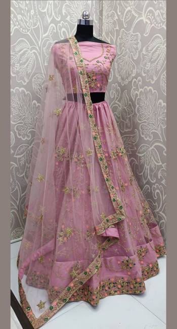 You Will Definitely Earn Lots Of Compliments Wearing This Heavy Designer Lehenga Choli In All Over Pink Color. Its Heavy Embroidered Blouse, Lehenga And Dupatta Are Fabricated On Net. Its Detailed Embroidery And Lovely Color will Give You A Look Like Never Before. 