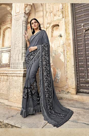 Here Is A Royal Looking Designer Saree In Grey Color. This Saree Is Fabricated On Lycra Paired With Art Silk Fabricated Blouse. It Is Bautified With Hand Work Patch And Fancy Lace Border