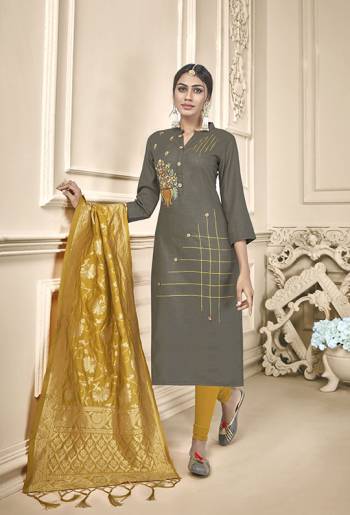 Celebrate This Festive Season With Beauty And Comfort Wearing This Designer Straight Suit In Dark Grey Color Paired With Contrasting Musturd Yellow Colored Bottom And Dupatta. This Dress Material Is Cotton based Paired With Banarasi Silk Fabricated Dupatta. Buy Now.