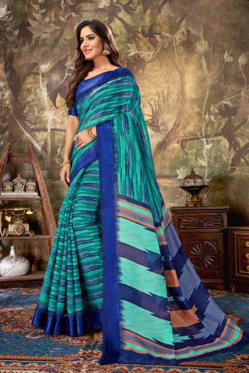 For Your Semi-Casual Wear, Grab This Designer Saree In Blue And Green Color Paired With Royal Blue Colored Blouse. This Saree Is Cotton Based Beautified With Prints Paired With Cotton Silk Fabricated Blouse. 