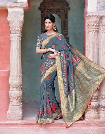 This grey saree with floral weaves is a mark of finesse and urban style. Keep the look minimal by adding subtle accessories and look enchanting. 