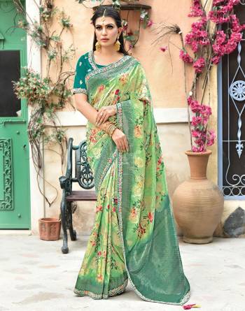 This silk saree is all about its poetic composition with ornate floral prints, flourishing colors and immaculate details that sing the tunes of festivities.  