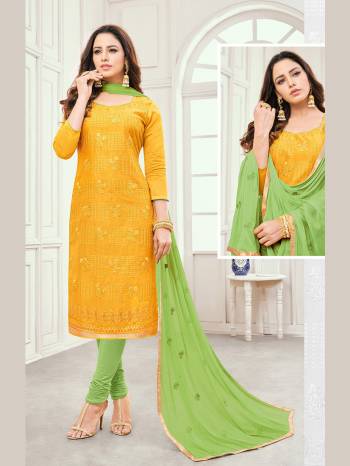 Celebrate This Festive Season With Beauty And Comfort Wearing This Pretty Suit In Yellow Colored Top Paired With Green Colored Bottom And Dupatta. Its Top Is Fabricated On Cotton Satin Paired With Cotton Bottom And Chiffon Fabricated Dupatta. Get This Dress Material Stitched As Per Youe Desired Fit And Comfort. 