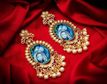 Grab This Beautiful And Attractive Pair Of Elegant Earrings Set In?Golden Color. This Pretty Pair Is Beautified With Stone Work And Can Be Paired With Any Colored Traditional Attire. Buy Now.