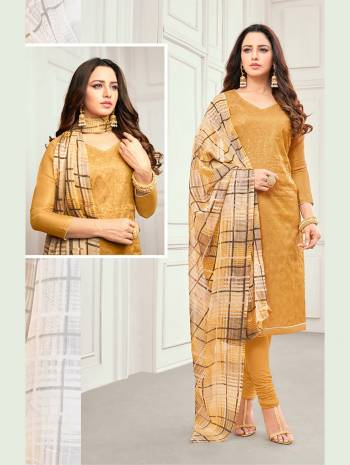 Grab This Pretty Suit In Musturd Yellow Color For Your Casual Or Semi-Casual Wear. Its Pretty Embroidered Top Is Fabricated On Linen Satin Paired With Cotton Bottom And Brasso Fabricated Dupatta. Buy This Dress Material Now.