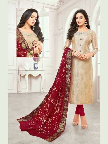 For A Royal Look, Grab This Elegant Dress Material In Golden And Maroon Color And Get This Stitched As Per Your Desired Fit And Comfort. Its Top Is Satin Silk Based Paired With Cotton Bottom And Bandhani Jacquard Dupatta. 