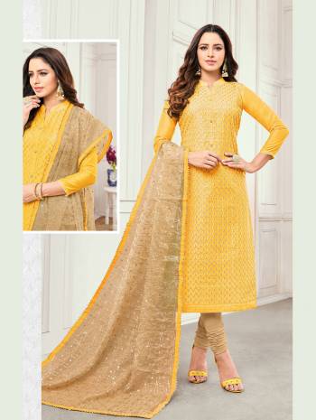 Simple And Elegant Looking Designer Suit Is Here In Yellow Colored Top Paired With Beige Colored Bottom And Dupatta. This Dress Material Is Satin Cotton Based Paired With Cotton Bottom And Net Fabricated Dupatta. It I Beautified With Detailed Embroidery Over The Top And Dupatta. 