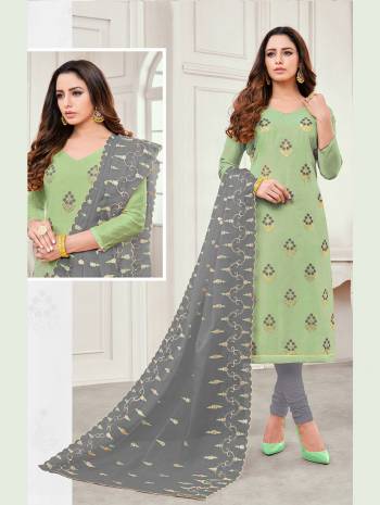 You Will Definitely Earn Lots Of Compliments Wearing This Designer Straight Suit In Light Green Color Paired With Contrasting Grey Colored Bottom And Dupatta. This Dress Material Is Cotton based Paired With Orgenza Fabricated Dupatta. 