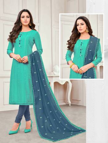 Here Is A Designer Straight Suit In Sea Blue Colored Top Paired With Blue Colored Bottom And Dupatta. Its Top And Dupatta are Satin Cotton Based Paired With Cotton Fabricated Bottom. Buy This Dress Material Now.