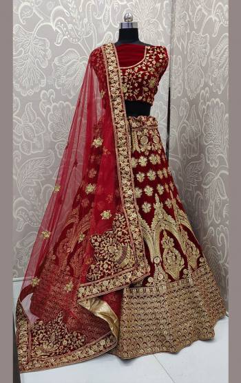 Here Is Trending Very Beautiful Heavy Designer Lehenga Choli In All Over Maroon Color. Its Blouse And Lehenga Are Fabricated On Rich Velvet Beautified With Heavy Embroidery Paired With Net Fabricated Heavy Embroidered Dupatta. Buy This Pretty Piece Now.