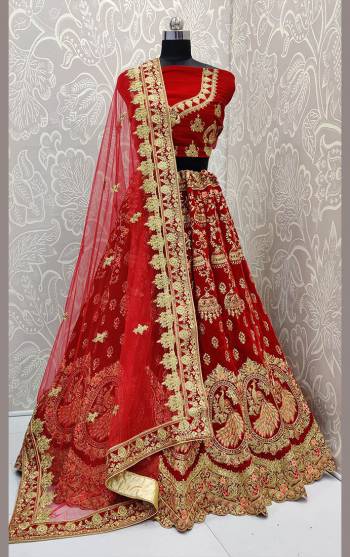 Get Ready For Your D-Day With This Very Beautiful And Heavy Designer Lehenga Choli In Red Color. This Heavy Embroidered Lehenga Choli Is Fabricated On Velvet Paired With Net Fabricated Dupatta. Its Rich Fabric And Heavy Detailed Embroidery Will Give An Attractive Look To Your Personality. 