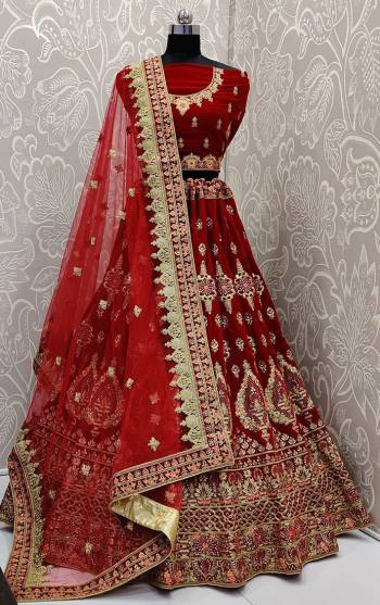 Get Ready For Your D-Day With This Very Beautiful And Heavy Designer Lehenga Choli In Red Color. This Heavy Embroidered Lehenga Choli Is Fabricated On Velvet Paired With Net Fabricated Dupatta. Its Rich Fabric And Heavy Detailed Embroidery Will Give An Attractive Look To Your Personality. 