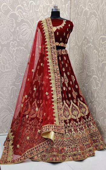 Here Is Trending Very Beautiful Heavy Designer Lehenga Choli In All Over Maroon Color. Its Blouse And Lehenga Are Fabricated On Rich Velvet Beautified With Heavy Embroidery Paired With Net Fabricated Heavy Embroidered Dupatta. Buy This Pretty Piece Now.