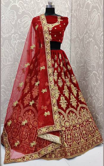 Here Is Trending Very Beautiful Heavy Designer Lehenga Choli In All Over Maroon Color. Its Blouse And Lehenga Are Fabricated On Rich Velvet Beautified With Heavy Embroidery Paired With Net Fabricated Heavy Embroidered Dupatta. Buy This Pretty Piece Now.