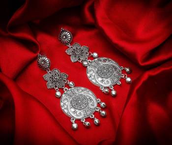 Buy This Pretty Pair Of Earrings In Silver Color Which Can Be Paired With Colored Attire. These Earrings Will Give A Pretty Elegant Look Which Will eanr You Lots Of Compliments From Onlookers