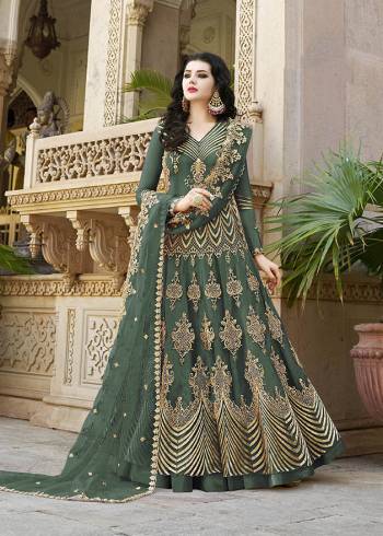 Look Pretty Wearing This Heavy Designer Floor Length Suit In Net Based Which Is In All Over Teal Green Color. Its Top And Dupatta Are Beautified With Heavy Embroidery Which Gives An Attractive Look To Your Personality. 