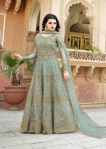 You Will Definitely Earn Lots of Compliments Wearing This Heavy Designer Floor Length Suit In Dusty Green Color. Its Heavy Embroidered Top and Dupatta Are Net Based Paired With Satin Fabricated Bottom. Buy Now.