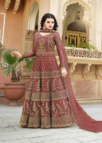 You Will Definitely Earn Lots of Compliments Wearing This Heavy Designer Floor Length Suit In Crimson Red Color. Its Heavy Embroidered Top and Dupatta Are Net Based Paired With Satin Fabricated Bottom. Buy Now.