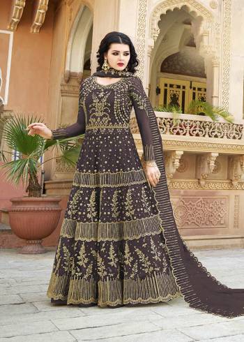 You Will Definitely Earn Lots of Compliments Wearing This Heavy Designer Floor Length Suit In Dark Wine Color. Its Heavy Embroidered Top and Dupatta Are Net Based Paired With Satin Fabricated Bottom. Buy Now.