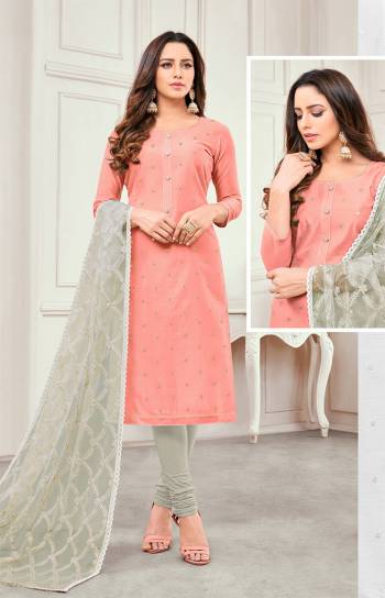 Rich And Elegant Looking Designer Straight Suit Is Here In Peach Colored Top Paired With Grey Colored Bottom And Dupatta. This Dress Material Is Satin Cotton Based Paired With Net Fabricated Dupatta. It Is Beautified With Elegant Embroidery Which Will Earn You Lots Of Compliments From Onlookers. 