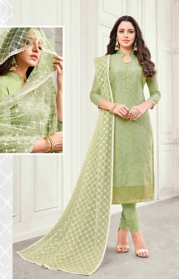 Flaunt Your Rich And Elegant Taste Wearing This Designer Suit In All Over Light Green Color. Its Top IS Satin Cotton Based Paired With Cotton Bottom And Net Fabricated Embroidered Dupatta. Buy Now.