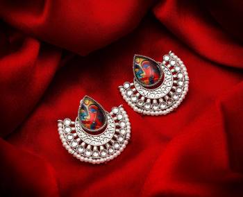 Grab This Beautiful And Attractive Pair Of Elegant Earrings Set In Silver Color. This Pretty Pair Is Beautified With Stone Work And Can Be Paired With Any Colored Traditional Attire. Buy Now.