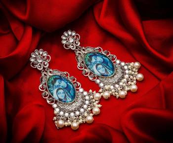 For An Attractive Look, Pair up This Beautiful Pair Of Earrings In Silver Color Which Can Be Paired With Any Colored Ethnic Attire. It Is Light In Weight And Easy To Carry All Day Long.