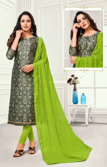 Grab This Simple Dress Material For Your Casual Or Semi-Casual Wear In Dark Grey Colored Top Paired With Green Colored Bottom And Dupatta. This Dress Material Is Cotton Based Paired With Chiffon Fabricated Dupatta. Buy Now.