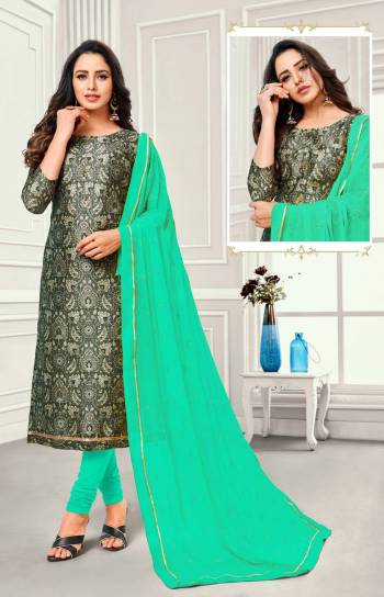 Grab This Simple Dress Material For Your Casual Or Semi-Casual Wear In Dark Grey Colored Top Paired With Sea  Green Colored Bottom And Dupatta. This Dress Material Is Cotton Based Paired With Chiffon Fabricated Dupatta. Buy Now.