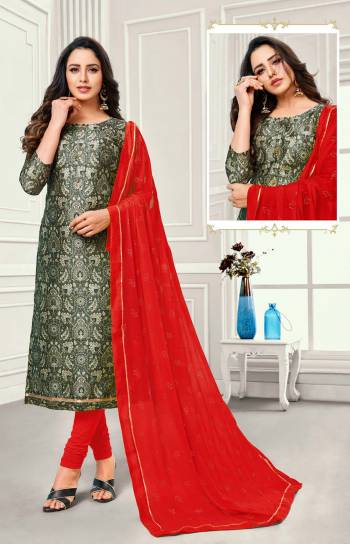 Grab This Simple Dress Material For Your Casual Or Semi-Casual Wear In Dark Grey Colored Top Paired With Red Colored Bottom And Dupatta. This Dress Material Is Cotton Based Paired With Chiffon Fabricated Dupatta. Buy Now.