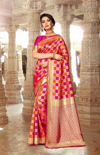 Here Is An Attractive Checkered Patterned Designer Silk Based Saree In Dark Pink And Orange Color Paired With Dark Pink Colored Blouse. Its Attractive Pattern And Color Pallete Will Earn You Lots Of Compliments From Onlookers.