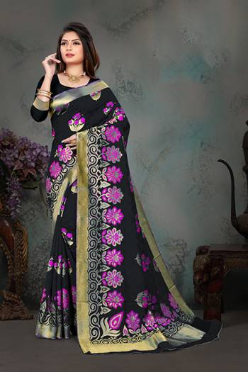 Grab This Pretty Foil Printed Designer Saree In Black Color Paired With Blue Colored Blouse, This Saree And Blouse Are Fabricated On Nylon Art Silk. Its Rich Fabric And Attractive Weave Will Earn You Lots Of Compliments From Onlookers. 