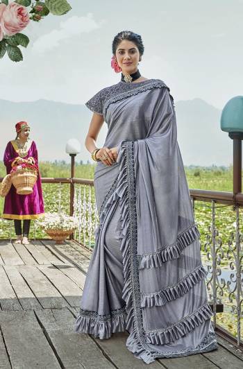 For A Royal Look, Grab This Designer Fancy Saree With Cape In All Over Grey Color. This Pretty Saree Is Fabricated On Lycra Paired With Art Silk Fabricated Blouse And Embroidered Net Fabricated Cape. Its Trendy Pattern And Design Will Earn You Lots Of Compliments From Onlookers.