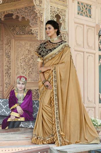 Grab This Very Beautiful Trendy Saree In Beige Color Paired With Dark Brown Colored Blouse And Cape. This Saree Is Fabricated On Lycra Paired With Art Silk Blouse And Net Fabricated Heavy Embroidered Cape. Its Fabric Is Light Weight And Ensures Superb Comfort Throughout The Gala.