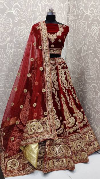 Get Ready For Your D-Day With This Very Beautiful And Heavy Designer Lehenga Choli In Red Color. This Heavy Embroidered Lehenga Choli Is Fabricated On Velvet Paired With Net Fabricated Dupatta. Its Rich Fabric And Heavy Detailed Embroidery Will Give An Attractive Look To Your Personality