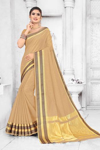 Grab This Pretty Elegant Looking Saree In Beige Color. This Saree Is Fabricated On Soft Cotton Paired With Art Silk Fabricated Blouse. It Is Beautified With Checks Foil Print And Lace Border. Also It Is Light In Weight And Easy To Carry All Day Long. 