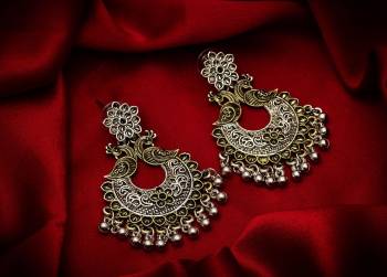 Give A Traditional Touch To Your Look With Pairing This Beautiful Pair Of Earrings In Silver Color. This Pretty Pair Can Be Paired With Any Colored Attire Which Give An Enhanced Look To Your Personality. 