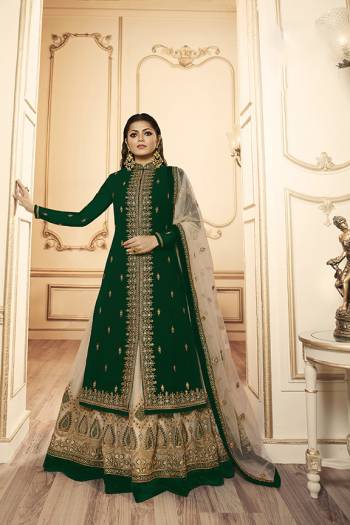 Grab This Beautiful And Heavy Designer Suit With Two Bottoms In Dark Green And Cream Color. Its Embroidered Top Is Fabricated Georgette Satin Paired With One Santoon Plain Bottom And Another Embroidered Lehenga Is Fabricated On Net Paired With Net Fabricated Dupatta. Its Rich Color Pallete And Detailed Embroidery Will Eanr You Lots Of Compliments From Onlookers. 