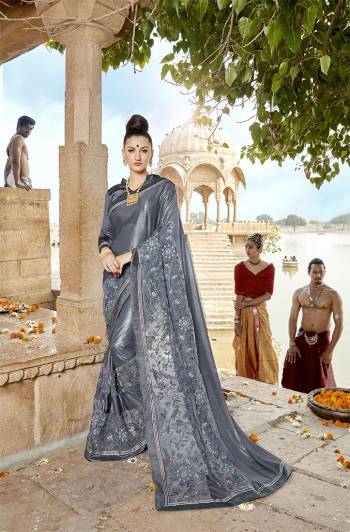 Flaunt Your Rich And Elegant Taste Wearing This Designer Saree In Elegant Grey Color .This Saree Is Fabricated on Lycra And Net Paired With Art Silk Fabricated Blouse. Buy This Saree Now.