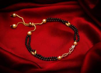 Here Is Very Pretty And Trending Mangalsutra Bracelet In Black And?Gold. This Mangalsutra Bracelet Has A Pretty Delicate Design And Pattern Which Gives An Elegant Look To Your Wrist. Buy This Latest Trend Now.?