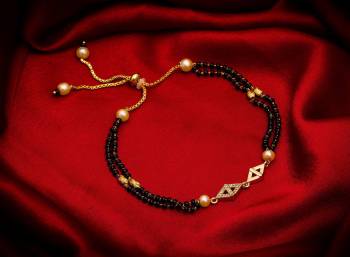 Here Is Very Pretty And Trending Mangalsutra Bracelet In Black And?Gold. This Mangalsutra Bracelet Has A Pretty Delicate Design And Pattern Which Gives An Elegant Look To Your Wrist. Buy This Latest Trend Now.?