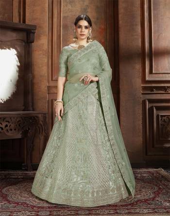 Flaunt Your Rich And Elegant Taste Wearing This Heavy Designer Lehenga Choli In Mint Green Color. This Beautifully Embroidered Heavy Lehenga Choli And Its Dupatta Are Fabricated On Net. Its Elegant Color And Detailed Embroidery Will Earn You Lots Of Compliments From Onlookers. 